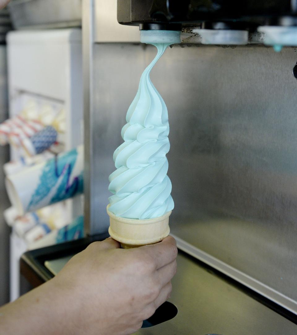 A cone of blue moon soft-serve ice cream is prepared at Denny's Ice Cream Stand at 929 Parade St.