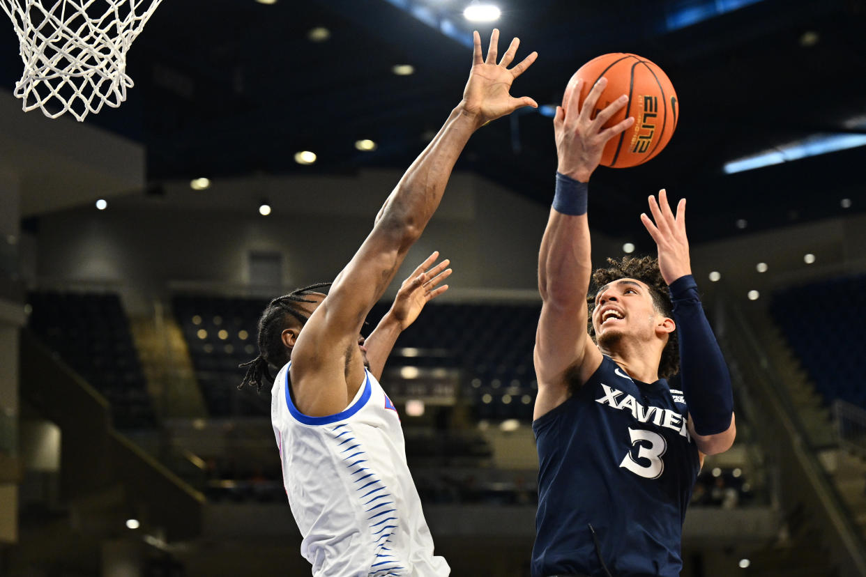 Xavier guard Colby Jones drives to the basket as DePaul forward Eral Penn defends in the first half at Wintrust Arena in Chicago on Jan. 18, 2023. (Jamie Sabau/USA TODAY Sports)