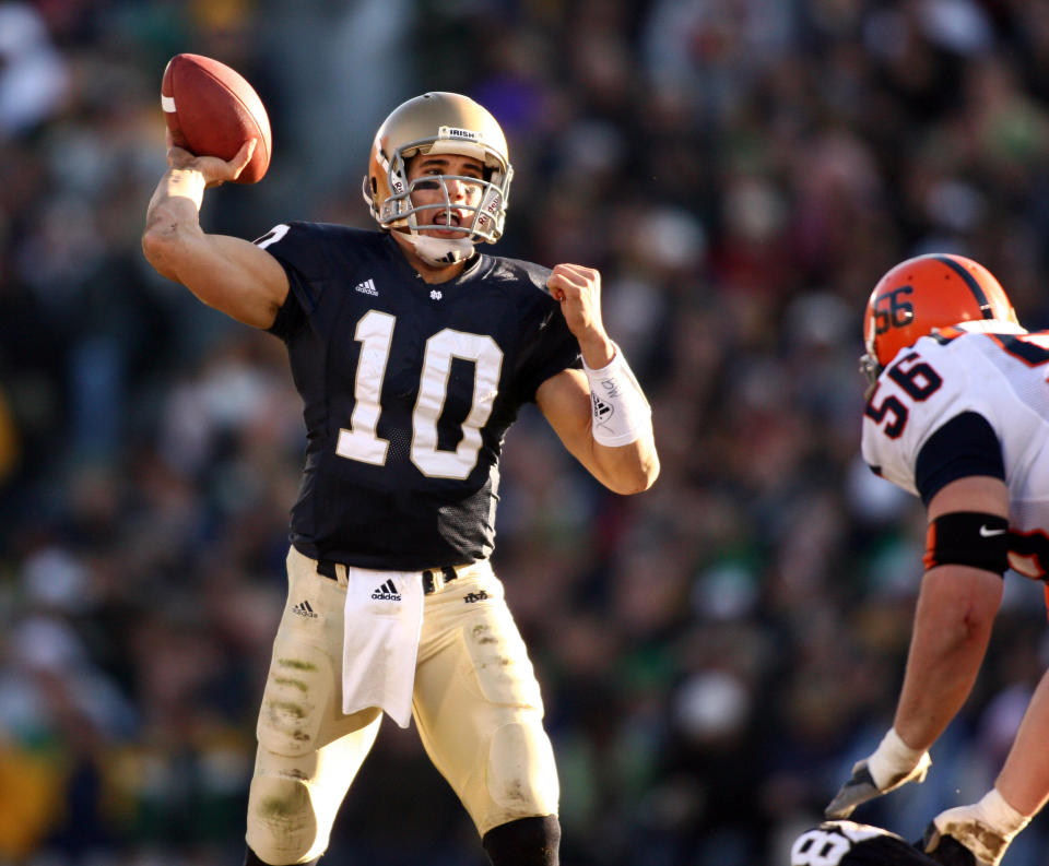 Nov. 19, 2005; South Bend, IN, USA; Notre Dame Fighting Irish quarterback (10) Brady Quinn throws the ball as Syracuse Orange defensive tackle (56) Chris Thorner pressures in the third quarter. Notre Dame defeated Syracuse 34-10. Photo By Matt Cashore-USA TODAY Sports