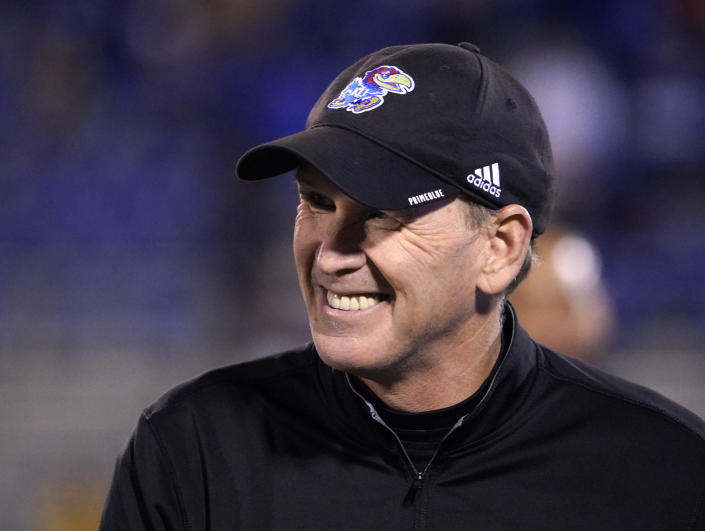 Kansas head coach Lance Leipold watches his team warm up prior to an NCAA college football game against West Virginia Saturday, Nov. 27, 2021, in Lawrence, Kan. (AP Photo/Ed Zurga)