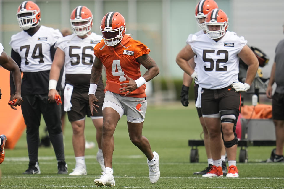 Cleveland Browns quarterback Deshaun Watson warms up during NFL football practice in Berea, Ohio, Wednesday, May 22, 2024. (AP Photo/Sue Ogrocki)