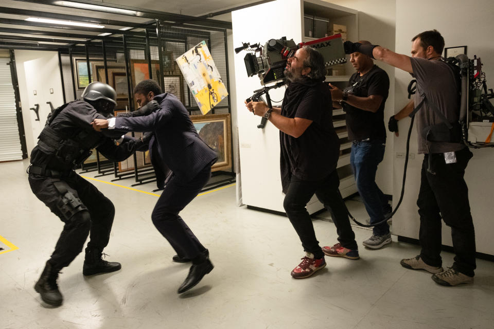 (L-r) John David Washington and DP Hoyte Van Hoytema on the set of Tenet. (Warner Bros.)