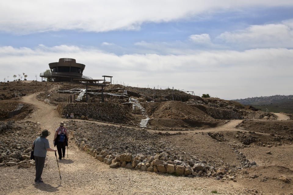 In this Tuesday, March 12, 2019 photo, tourists visit the archaeological site of Tel Shiloh in the West Bank. Deep in the West Bank, an Israeli settlement has transformed the archaeological site into a biblical tourist attraction that is drawing tens of thousands of Evangelical Christian visitors each year. Critics say the site promotes a narrow interpretation of history popular with Israeli settlers and their Christian supporters. (AP Photo/Sebastian Scheiner)
