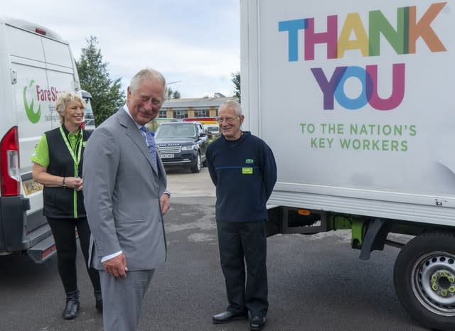 Charles with Asda staff members 