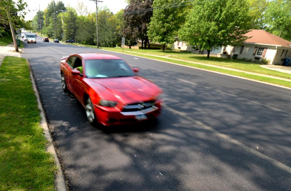 A car travels down part of the resurfaced Chatham Road on Wednesday. [Thomas J. Turney/The State Journal-Register]