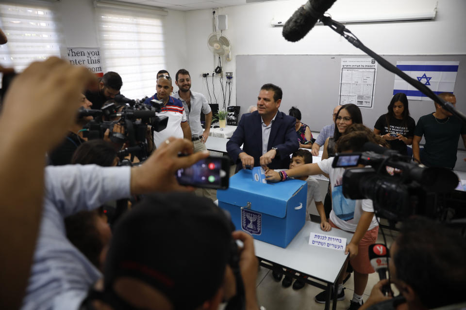 Israeli Arab politician Ayman Odeh casts his vote in Haifa, Israel, Tuesday, Sept. 17, 2019. Israelis began voting Tuesday in an unprecedented repeat election that will decide whether longtime Prime Minister Benjamin Netanyahu stays in power despite a looming indictment on corruption charges. (AP Photo/Ariel Schalit)