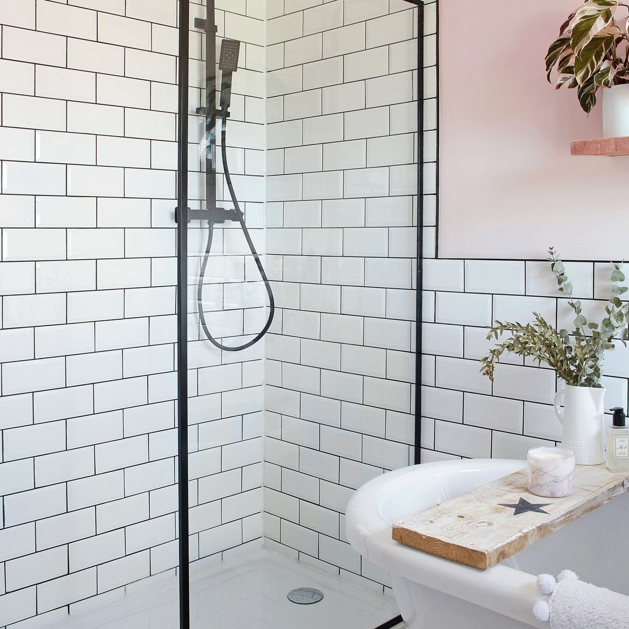  White bathroom with pink walls. 