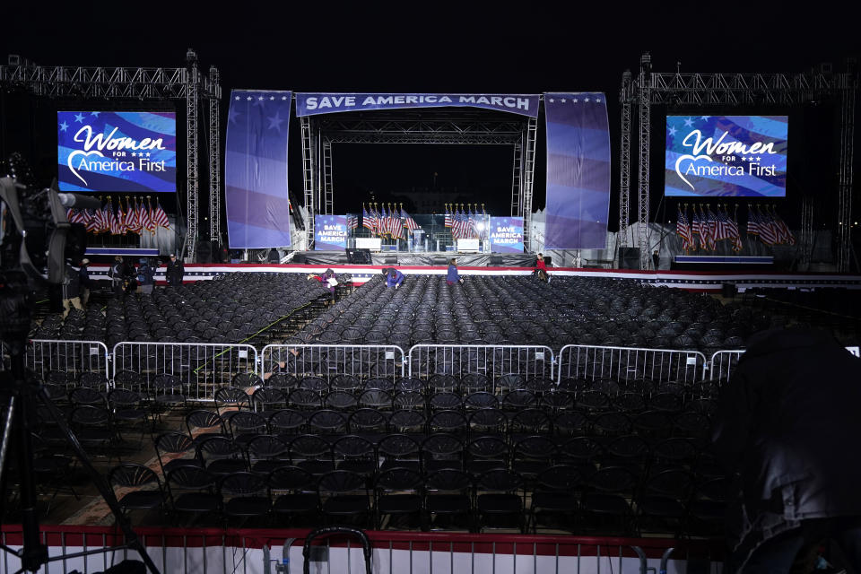 FILE - In this Jan. 6, 2021 file photo people adjust final details before allowing people in for a rally in support of President Donald Trump. An AP review of records finds that members of President Donald Trump’s failed campaign were key players in the Washington rally that spawned a deadly assault on the U.S. Capitol last week. (AP Photo/Jacquelyn Martin, File)