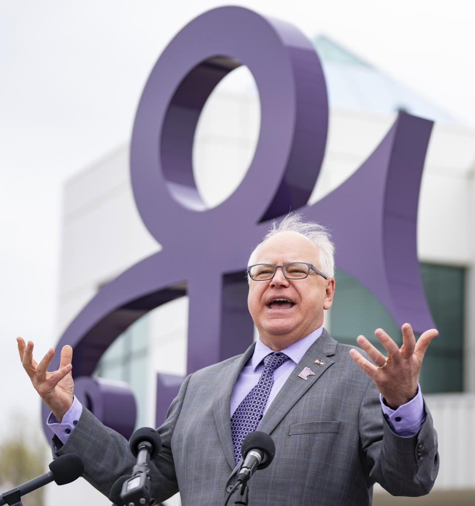 Minnesota Gov. Tim Walz speaks to the press before signing a bill renaming a 7-mile stretch of Highway 5 as "Prince Rogers Nelson Memorial Highway", Tuesday, May 9, 2023, at Paisley Park in Chanhassen, Minn. (Alex Kormann/Star Tribune via AP)