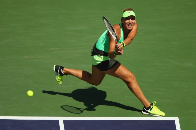 Elena Vesnina of Russia plays a backhand against Svetlana Kuznetsova of Russia on March 19, 2017 in Indian Wells, California