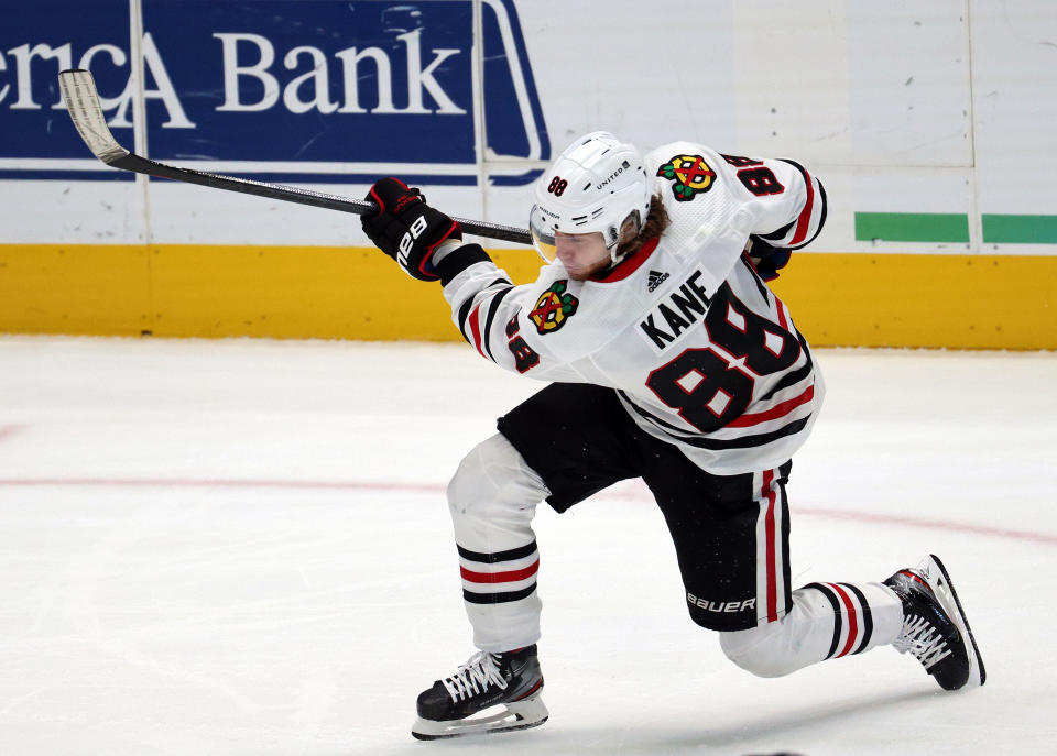 DALLAS, TEXAS - MARCH 09:  Patrick Kane #88 of the Chicago Blackhawks takes a shot against the Dallas Stars in the first period while playing in his 1000th NHL game at American Airlines Center on March 09, 2021 in Dallas, Texas. (Photo by Ronald Martinez/Getty Images)