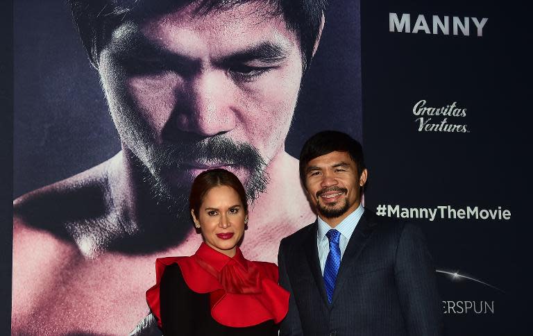 Philippine boxing champion Manny Pacquiao arrives with his wife Jinkee for the premiere of "Manny" in Hollywood on January 20, 2015