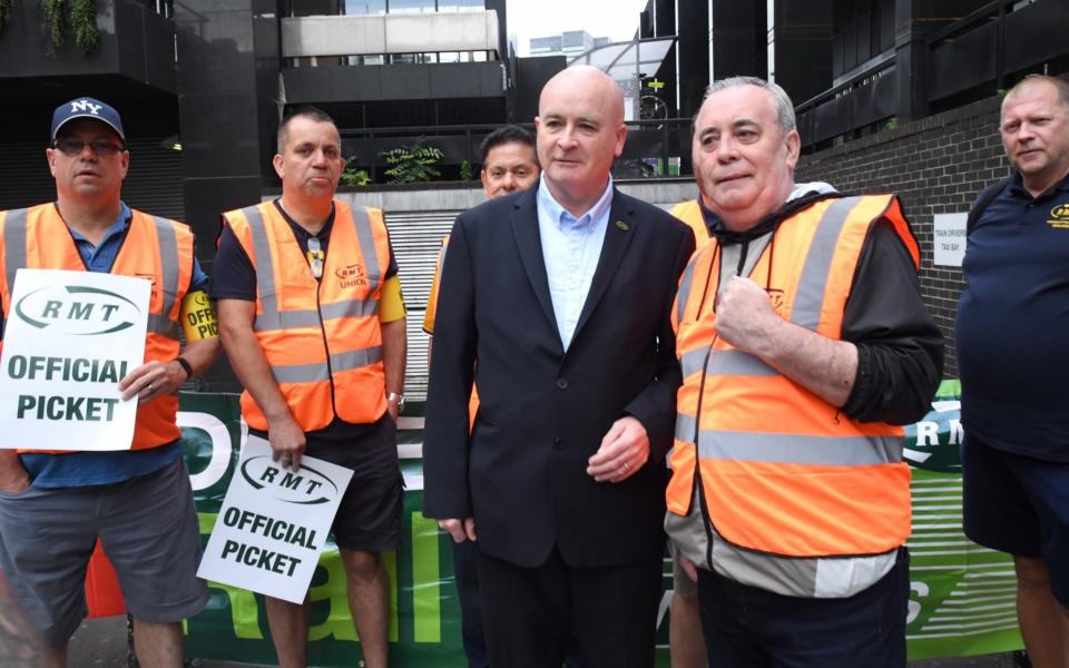 Mick Lynch, the general secretary of the RMT union, is pictured on the picket line at Euston Station in central London this morning  - Jeremy Selwyn/SelwynPics