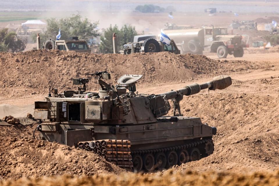 Israeli soldiers prepare for ground maneuvers at an undisclosed location near the border with Gaza (EPA)