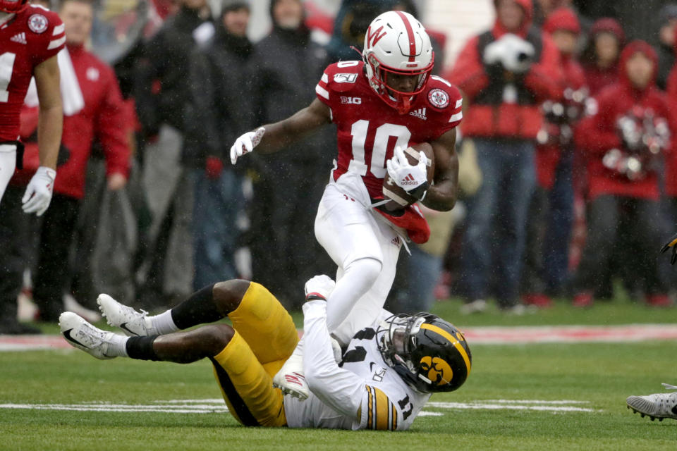 Nebraska wide receiver JD Spielman (10) is tackled by Iowa defensive back Michael Ojemudia (11) during the first half of an NCAA college football game in Lincoln, Neb., Friday, Nov. 29, 2019. (AP Photo/Nati Harnik)