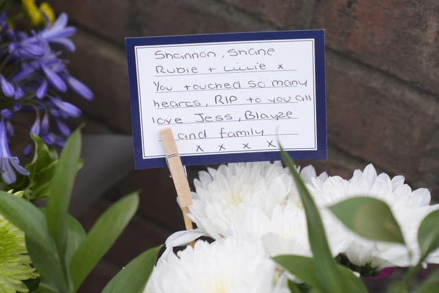 Flowers and tributes laid near the scene