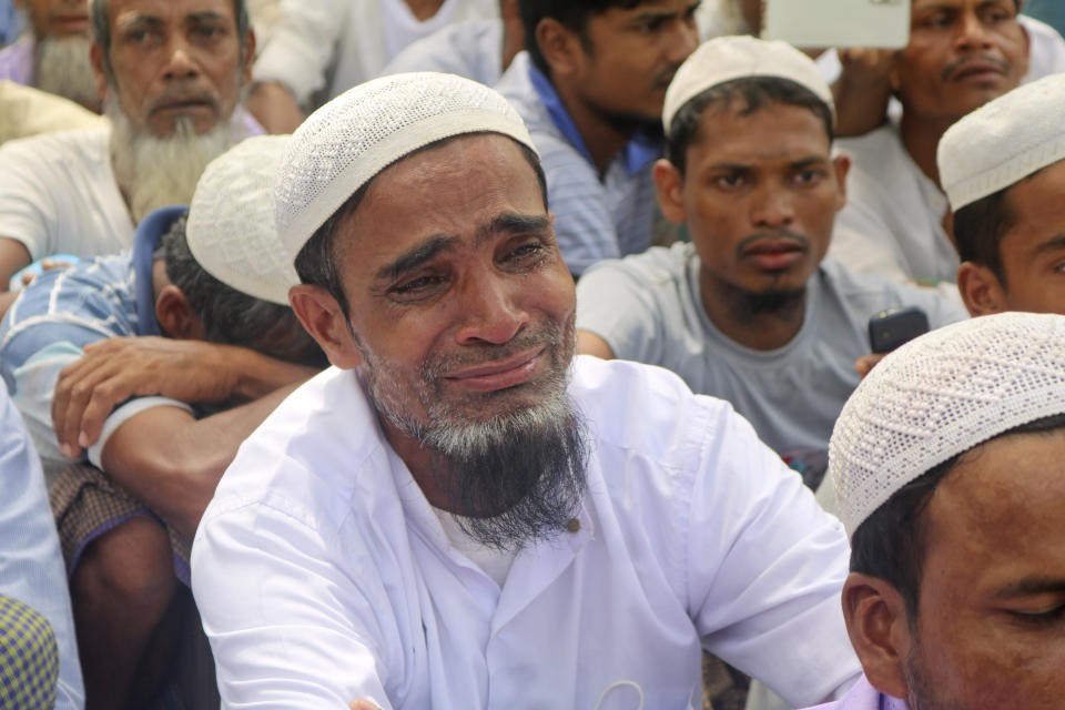 A Rohingya refugees cries during a gathering to mark the fifth anniversary of their exodus from Myanmar to Bangladesh, at a Kutupalong Rohingya refugee camp at Ukhiya in Cox's Bazar district, Bangladesh, Thursday, Aug. 25, 2022. Hundreds of thousands of Rohingya refugees on Thursday marked the fifth anniversary of their exodus from Myanmar to Bangladesh, while the United States, European Union and other Western nations pledged to continue supporting the refugees' pursuit of justice in international courts.(AP Photo/ Shafiqur Rahman)