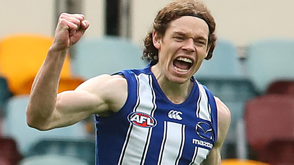 Ben Brown is pictured celebrating after kicking a goal.