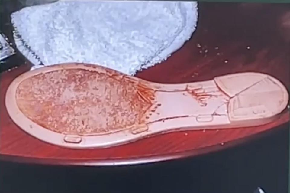<div class="inline-image__caption"><p>The bloody shoe found in the hotel room.</p></div> <div class="inline-image__credit">Osceola County Sheriff</div>