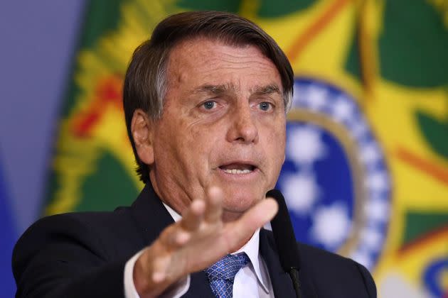 Brazilian President Jair Bolsonaro has presided over record destruction of the Amazon rainforest and sharp increases in the number of murders of Indigenous people, both of which have taken place as he has gutted protections for the forest and protected Indigenous lands. (Photo: EVARISTO SA via Getty Images)