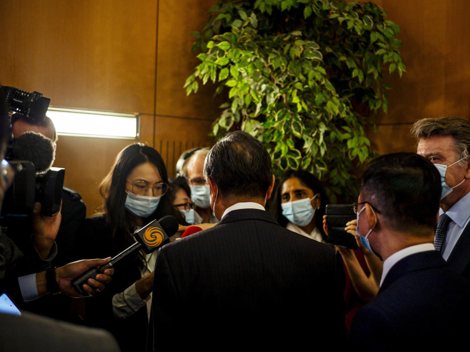 Chinese Foreign Minister Wang Yi speaks with journalists after a press conference at the Institute for International Relations in Paris, Sunday, Aug. 30, 2020. Chinese Foreign Minister Wang Yi is in France as part of a five-country trip to Europe, his first since the coronavirus pandemic. (AP Photo/Kamil Zihnioglu)