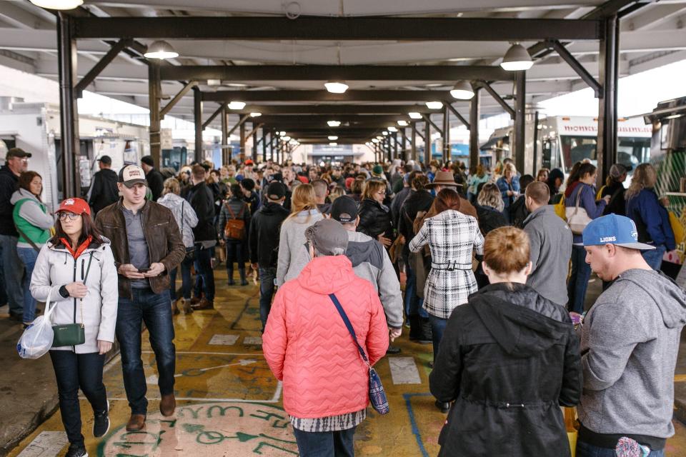 Visitors at All Things Detroit at Eastern Market in Detroit.