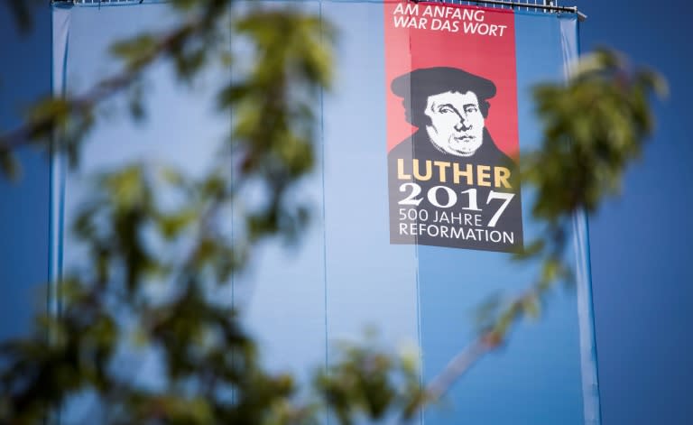 A portrait of Martin Luther is seen on the side of a giant book in Lutherstadt Wittenberg, eastern Germany