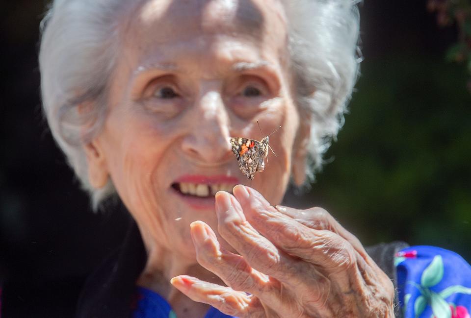 (5/20/21) 102-year-old Daisy Scaletta releases a painted lady butterfly at the butterfly release event at the Brookdale Lodi senior living facility in Lodi. CLIFFORD OTO/THE STOCKTON RECORD