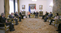 In this photo provided by Egypt's presidency media office, Egyptian President Abdel-Fattah el-Sissi, centre right, meets European Commission president Ursula Von der Leyen, centre left, and her delegations at the Presidential Palace in Cairo, Egypt, Sunday, March 17, 2024. (Egyptian Presidency Media Office via AP)