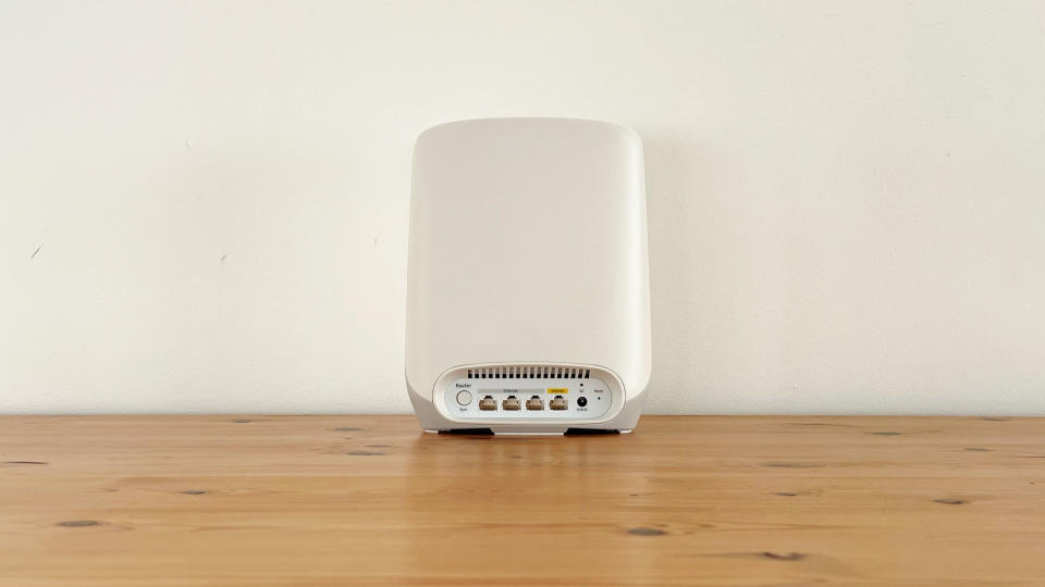 Netgear Orbi RBK763 on a wooden table