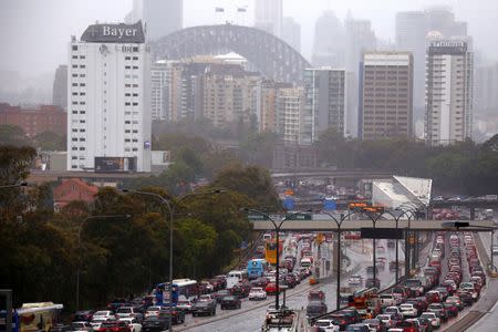 Cars and buses sit on a road that leads onto the Sydney Harbour Bridge as strong winds and floods cause traffic problems in Sydney, Australia, November 28, 2018. REUTERS/David Gray