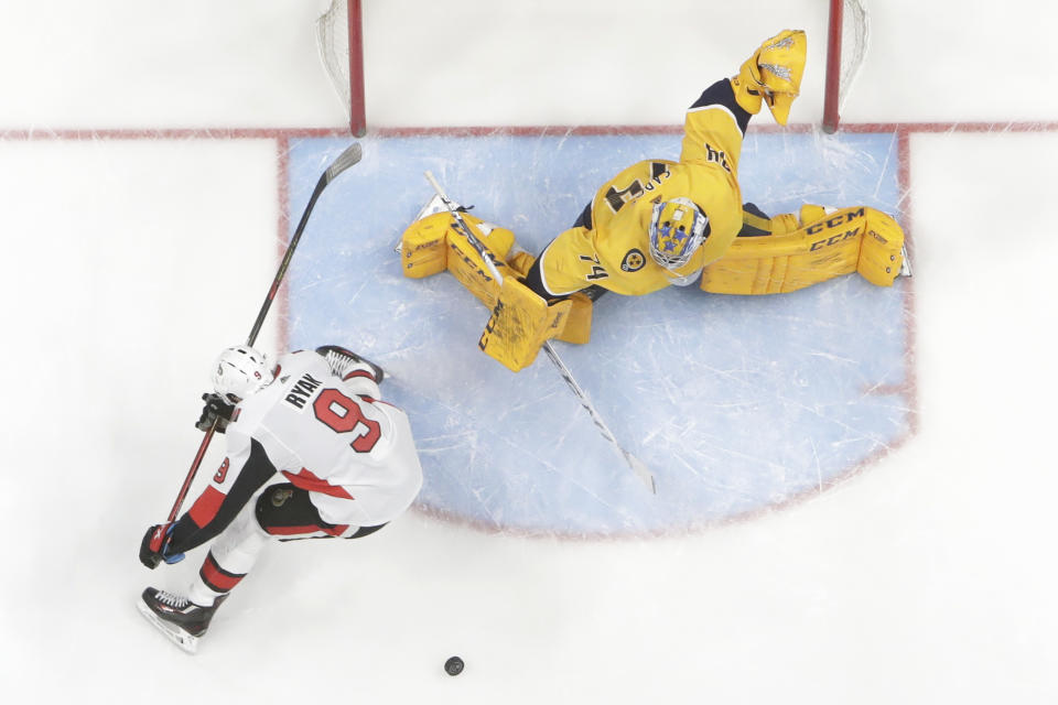 Nashville Predators goaltender Juuse Saros (74), of Finland, blocks a shot by Ottawa Senators right wing Bobby Ryan (9) on a breakaway in the second period of an NHL hockey game Tuesday, Feb. 25, 2020, in Nashville, Tenn. (AP Photo/Mark Humphrey)