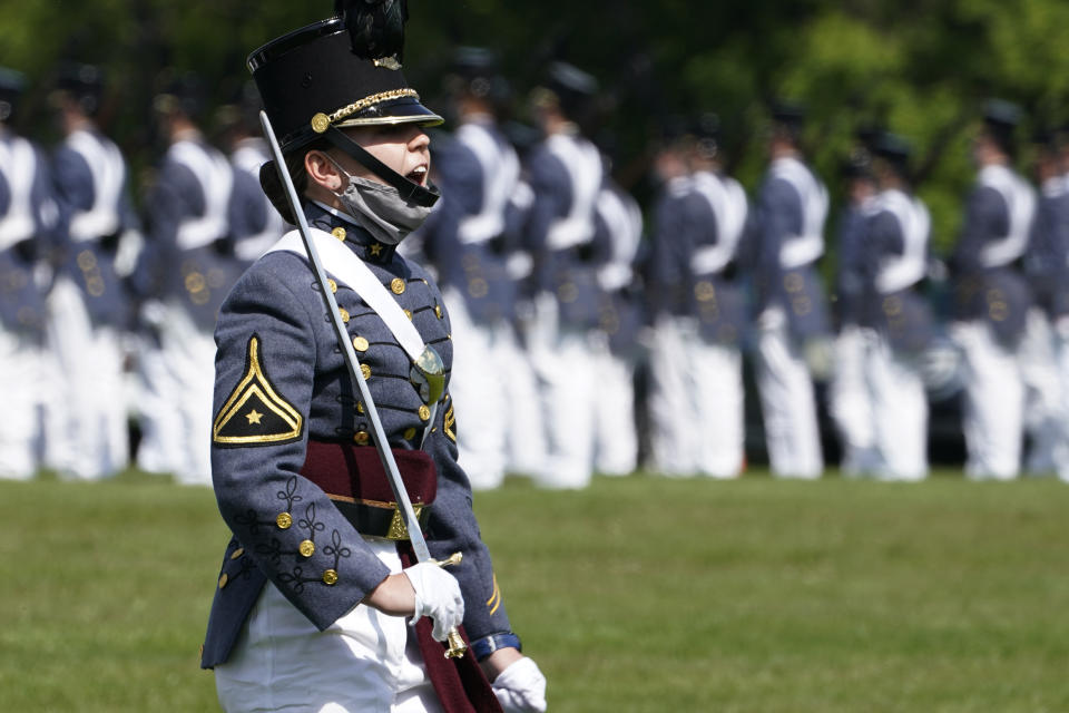 Corps of Cadet Commander Kasey Meredith, of Johnstown, Pa., yells a command as she leads the corps during a change of command parade and ceremony on the parade grounds at the school in Lexington, Va., Friday, May 14, 2021. Meredith will be the first female to lead the Virginia Military Institute's Corps of Cadets in its 182 year history. (AP Photo/Steve Helber)