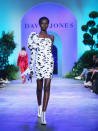 <p>Adut Akech rocked the runway in this one-sleeved, dalmation print minidress. Photo: Getty Images </p>