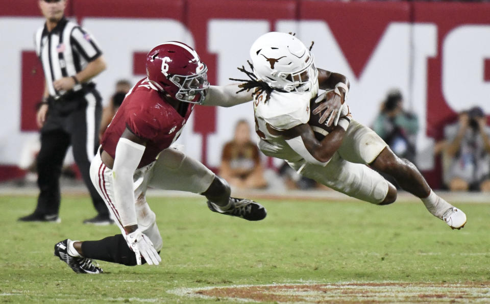 Sept. 9, 2023; Tuscaloosa, Alabama; Alabama defensive back Jaylen Key makes a tackle on Texas Longhorns running back Jonathon Brooks (24) at Bryant-Denny Stadium. Texas defeated Alabama 34-24. Gary Cosby Jr. -USA TODAY Sports