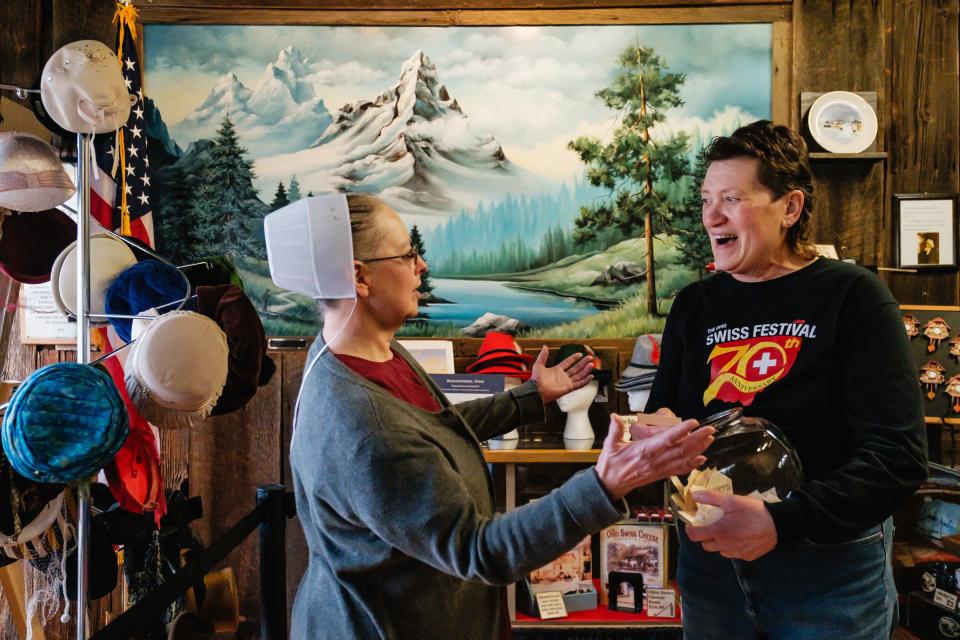 Becky Detwiler, right, curator of the Alpine Museum in Sugarcreek, and Esther Yoder, of Esther's Home Bakery, react to the first place winner's name drawn for a raffle drawing, Friday, Dec. 22. The winner, Margaret Nagy, will receive a hand-made cuckoo clock worth over $8,000.