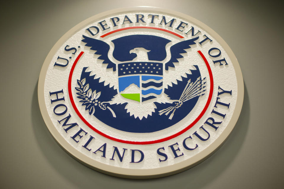 FILE - Homeland Security logo is seen during a joint news conference in Washington, Feb. 25, 2015. The Department of Homeland Security paused the work of its new disinformation governance board Wednesday. The move responds to weeks of criticism from Republicans and questions about whether the board would impinge on Americans’ free speech rights. A statement says DHS’ advisory board on homeland security will review the board’s work. (AP Photo/Pablo Martinez Monsivais, File)