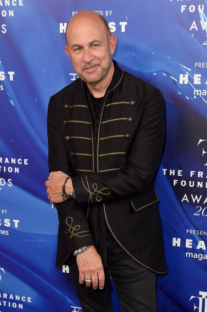 John Varvatos posing on the carpet of an event