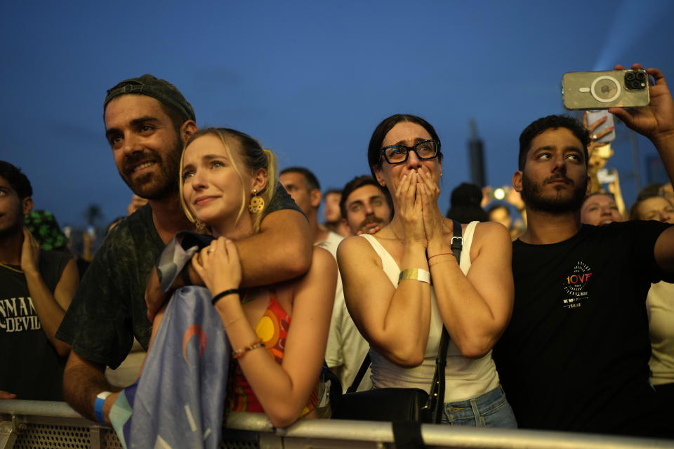 A woman weeps at the Nova Healing Concert in Tel Aviv, Israel, on Thursday, June 27, 2024. This was the first Tribe of Nova mass gathering since the Oct. 7, 2023 cross-border attack by Hamas that left hundreds at the Nova music festival dead or kidnapped to Gaza. (AP Photo/Ohad Zwigenberg)