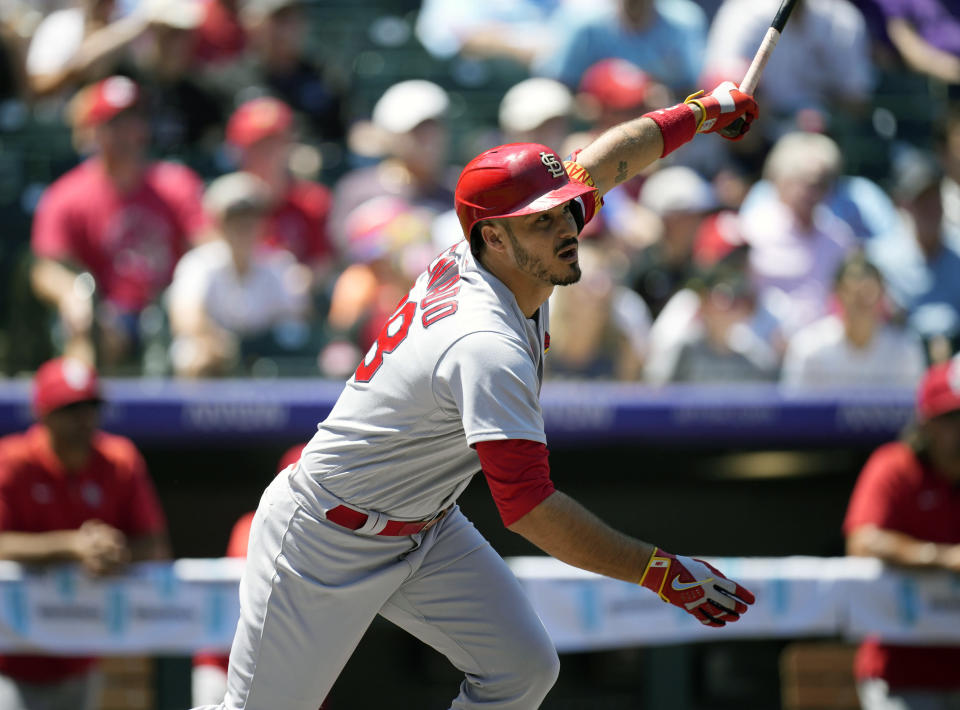 St. Louis Cardinals' Nolan Arenado flies out against Colorado Rockies starting pitcher German Marquez in the first inning of a baseball game Thursday, Aug. 11, 2022, in Denver. (AP Photo/David Zalubowski)