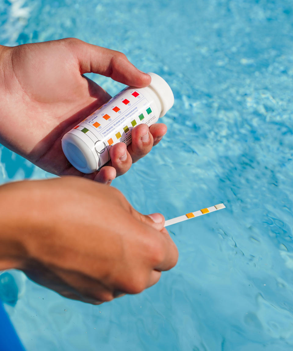 checking the pH levels in a pool