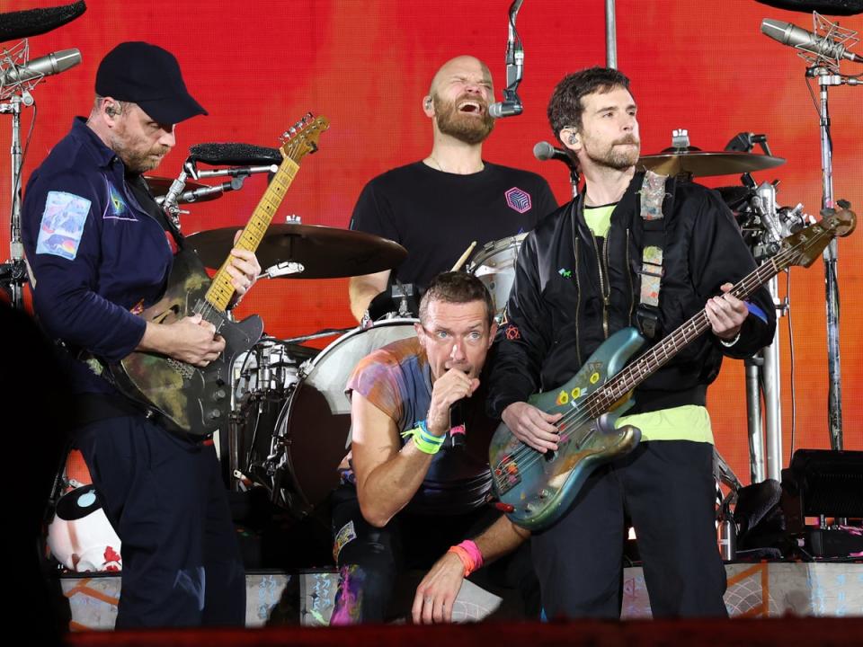 Jonny Buckland, Chris Martin, Will Champion and Guy Berryman of Coldplay performing at Rose Bowl Stadium on September 30, 2023 (Monica Schipper/Getty Images)
