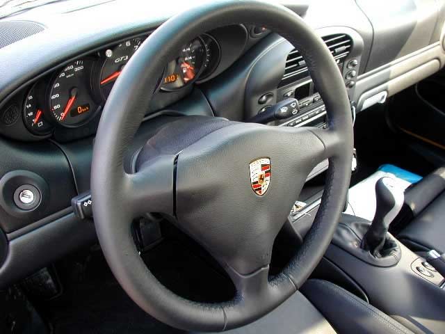 A black leather Porsche 996 GT3 steering wheel