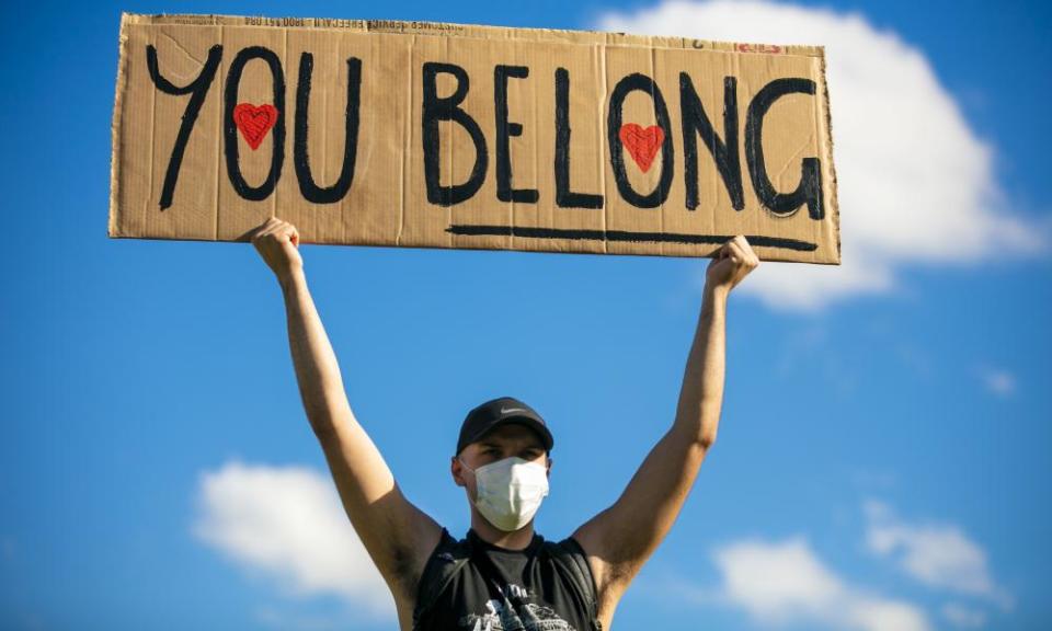 A man holding a banner