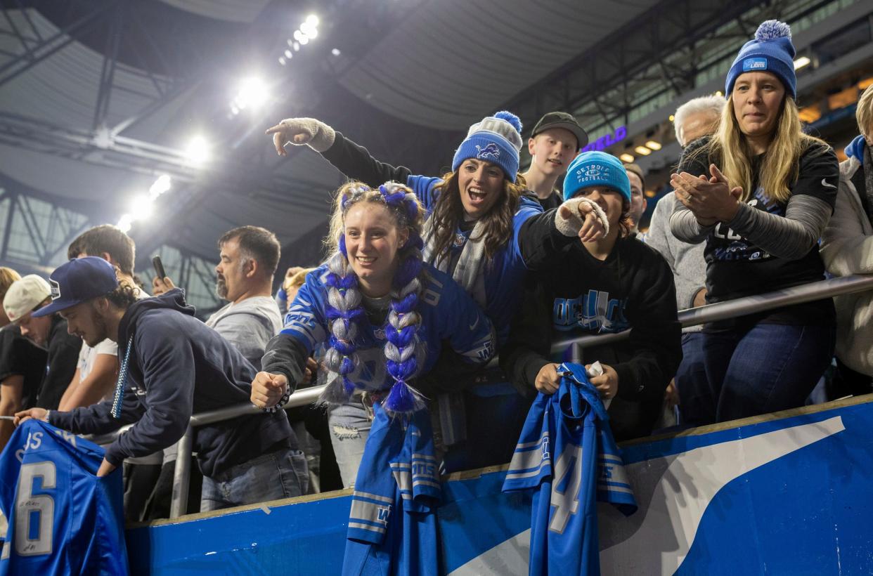 Lions fans celebrate at the end of the game against the Minnesota Vikings at Ford Field in Detroit on Sunday, Jan. 7, 2024.