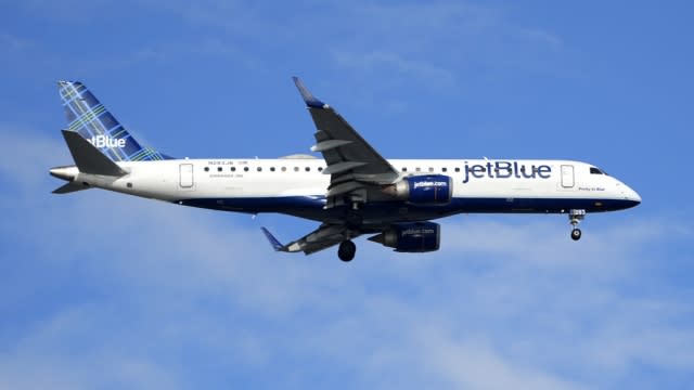 A Jet Blue airplane lands at Sarasota-Bradenton International Airport in Sarasota, Fla.