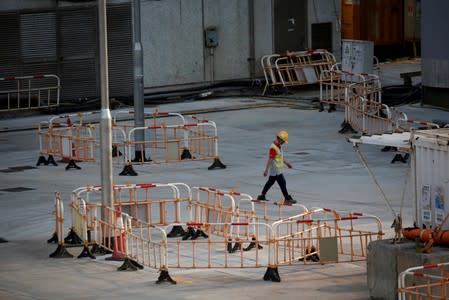 Worker walks at a construction site of MTR station at Hung Hom in Hong Kong