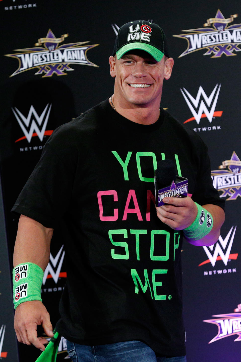 John Cena speaks during a news conference before Wrestlemania XXX at the Mercedes-Benz Super Dome in New Orleans on Sunday, April 6, 2014. (Jonathan Bachman/AP Images for WWE)