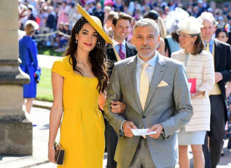 George Clooney et sa femme Amal lors du mariage royal en mai dernier [Photo: Getty]