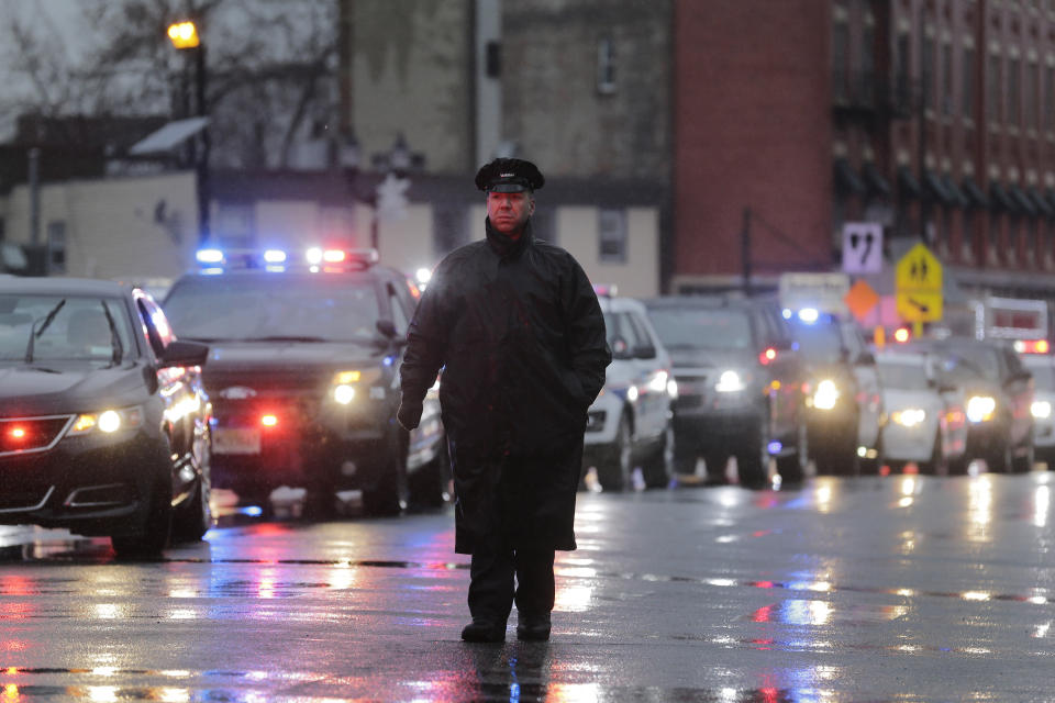 A traffic jam of police cars is seen before the funeral of Jersey City Police Detective Joseph Seals in Jersey City, N.J., Tuesday, Dec. 17, 2019. Funeral services for Seals are scheduled for Tuesday morning. The 40-year-old married father of five was killed in a confrontation a week ago with two attackers who then drove to a kosher market and killed three people inside before dying in a lengthy shootout with police. (AP Photo/Seth Wenig)